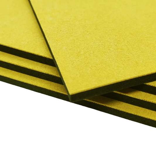 Stack of four sponge foam pads for self-inking stamps, showing yellow textured surface and black base.